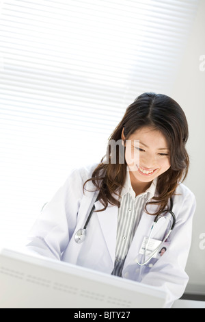 Female doctor using a computer Stock Photo
