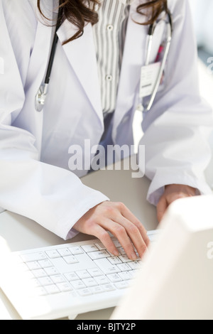 Female doctor using a computer Stock Photo