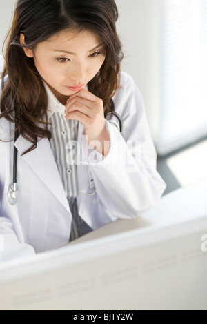 Female doctor using a computer Stock Photo
