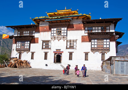 bhutanese people wearing traditional clothes in front of the Trashigang Dzong, Bhutan Stock Photo