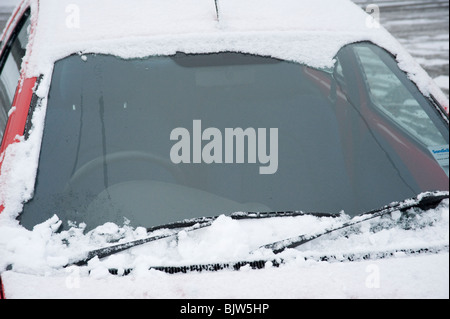 Clear car windscreen that has had all the snow and ice scraped off of it. Stock Photo