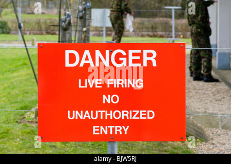 Red Military Danger Live Firing No Unauthorized Entry Sign Stock Photo