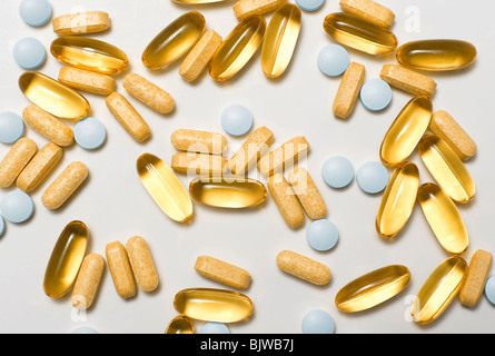 Random Arrangement of Various Food Supplement Pills and Capsules.  Omega 3 Fish Oils, Zinc Pills and Vitamin B Complex Pills Stock Photo