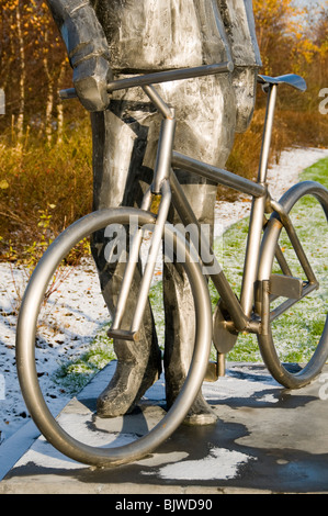 Sculpture depicting a male cyclist, Lord Sheldon Way, Ashton under Lyne, Tameside, Greater Manchester, England, UK Stock Photo