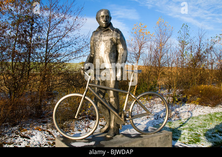 Sculpture depicting a male cyclist, Lord Sheldon Way, Ashton under Lyne, Tameside, Greater Manchester, England, UK Stock Photo