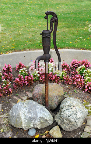 Historic old fashioned water well pump Stock Photo