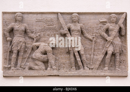 A bas-relief scene showing skiers, on the Olympiahaus in Garmisch-Partenkirchen, Germany. Stock Photo