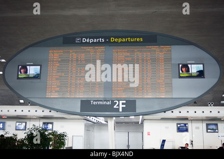 passengers looking at departure announcement board, Terminal 2, Charles de Gaulle airport Roissy,  France Stock Photo