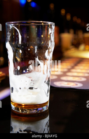 Pint glass on a bar Stock Photo