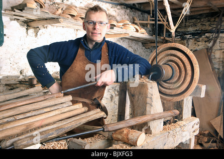 Woodturner Robin Wood and bowls in his workshop at Edale in the Peck District using a foot powered pole lathe. Stock Photo