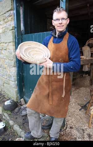 Woodturner Robin Wood and bowls in his workshop at Edale in the Peck District using a foot powered pole lathe. Stock Photo