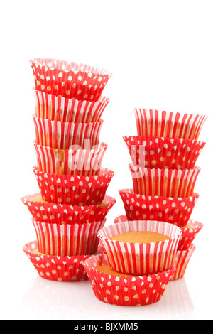 red spotted and striped cupcakes stacked over white Stock Photo