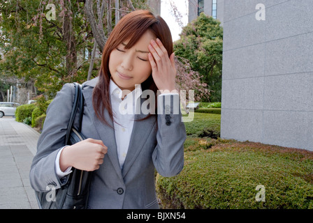 Young woman suffering from headache Stock Photo