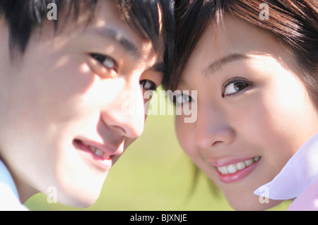 Young couple smiling, close-up Stock Photo