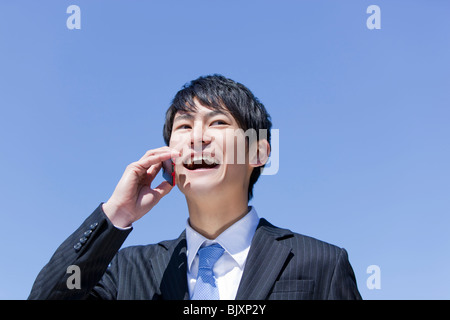 Young businessman talking on mobile phone Stock Photo