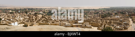 Long thin panoramic shot of the view from the Desert Lodge looking down over El-Qasr at  Dakhla Oasis. Western Desert, Egypt Stock Photo