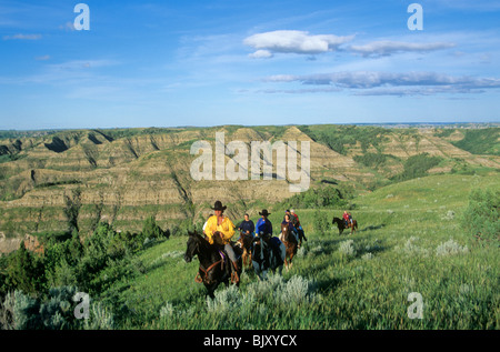 Trail riding in prairie and badlands at Little Missouri State Park, north of Killdeer, North Dakota, USA Stock Photo