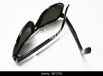 A pair of black sunglasses on a white background Stock Photo