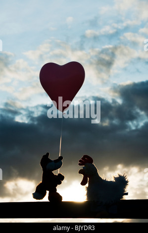 Fox and chicken friendship silhouette Stock Photo