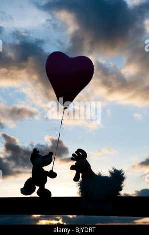 Fox and chicken friendship silhouette Stock Photo