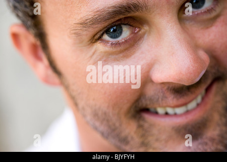 Close-up portrait of smiling young man Stock Photo