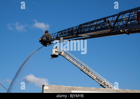 Two Aerial Ladders operate at 2nd Alarm Fire Detroit Michigan USA by Dembinsky Photo Assoc Stock Photo