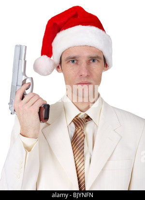 A young man in a Christmas hat with a gun Stock Photo