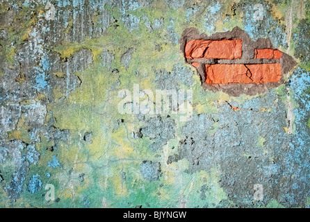 Dirty old wall with damage. We see the bricks. Stock Photo