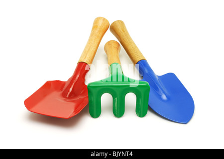 Colorful kids garden tools on white background Stock Photo