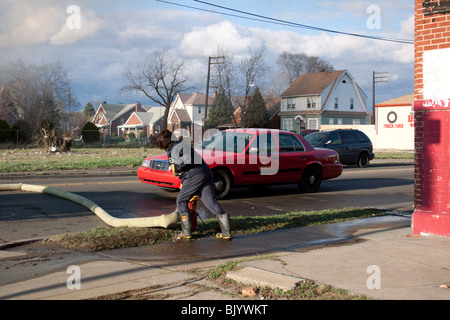Fire Engineer Operator opening fire hydrant at 2nd Alarm Fire Detroit Michigan USA by Dembinsky Photo Assoc Stock Photo