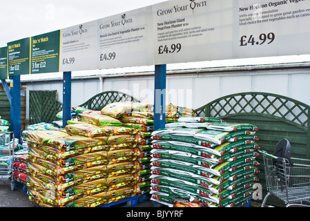 Bags of compost for sale at a garden centre in Wiltshire England UK EU Stock Photo