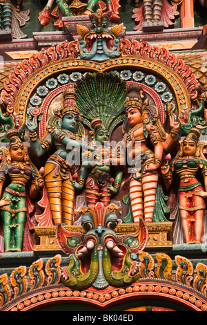India, Tamil Nadu, Madurai, Sri Meenakshi Temple, newly restored west gopuram crammed with deities Stock Photo