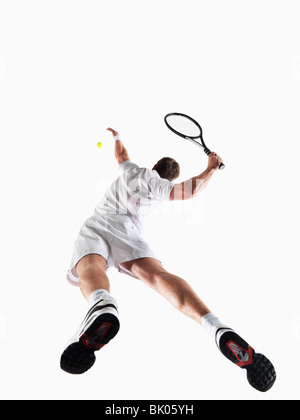 Man playing tennis Stock Photo