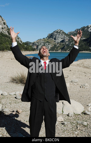 Business Man in the Mountains Stock Photo