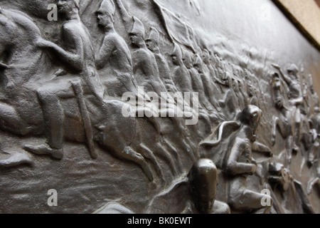 Situated on the Wellington statue in Piccadilly Gardens is this fine bronze relief by Mathew Noble. Stock Photo