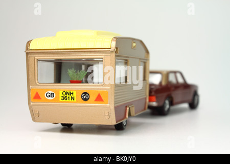 Toy caravan being towed by car Stock Photo