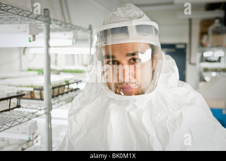 Middle Eastern scientist in clean suit in laboratory
