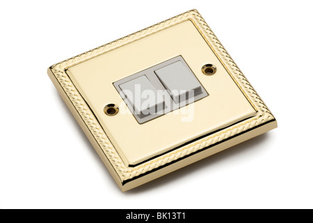 Double gold plated electric light switch Stock Photo