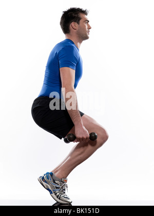 man doing workout squats weight training crouching on studio white isolated background Stock Photo