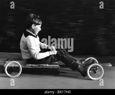 Boy driving a home-made go-kart, Horley, Surrey, 1965. Stock Photo