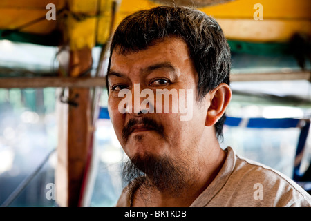 Chinaman on sampan in Hong Kong harbour. Stock Photo