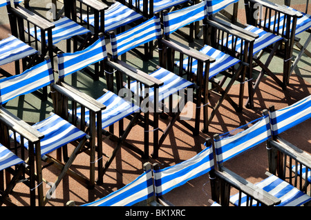 Canvas chairs on Eastbourne seafront Stock Photo