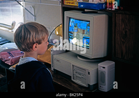American boy in front of his home computer, c. 1988