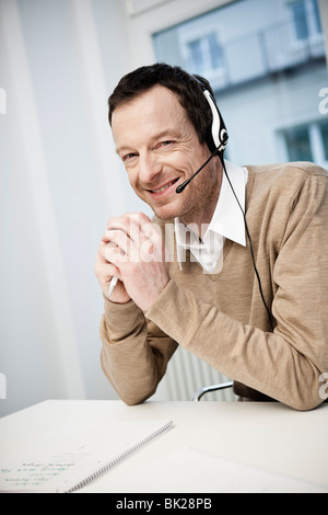 Male call center agent smiling Stock Photo
