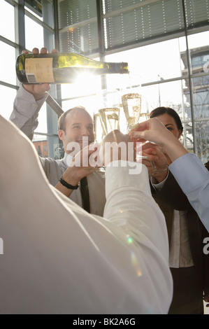 Happy business executives with champagne Stock Photo