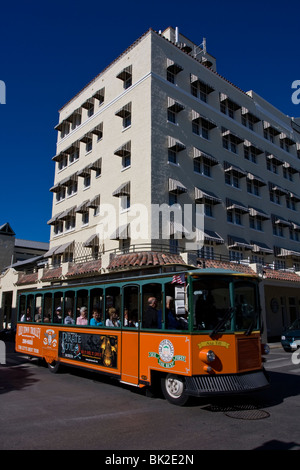 The Old Town Trolley bus passes the 1926 La Concha Hotel in Key West, Florida, USA. Stock Photo
