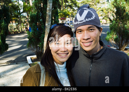 Smiling young student couple from Ho Chi Minh City visiting the Bao Dai Summer Palace in Dalat Vietnam Stock Photo