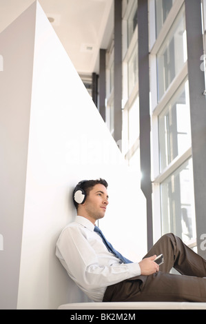 Man listening to music with headphones Stock Photo