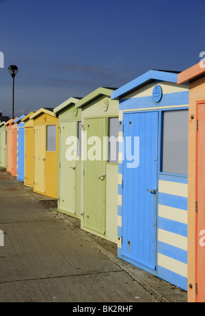 A row of colourful beach huts on Seaford Seafront, East Sussex, England. Stock Photo