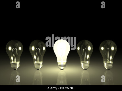 One bright light bulb next to unlit bulbs. Stock Photo